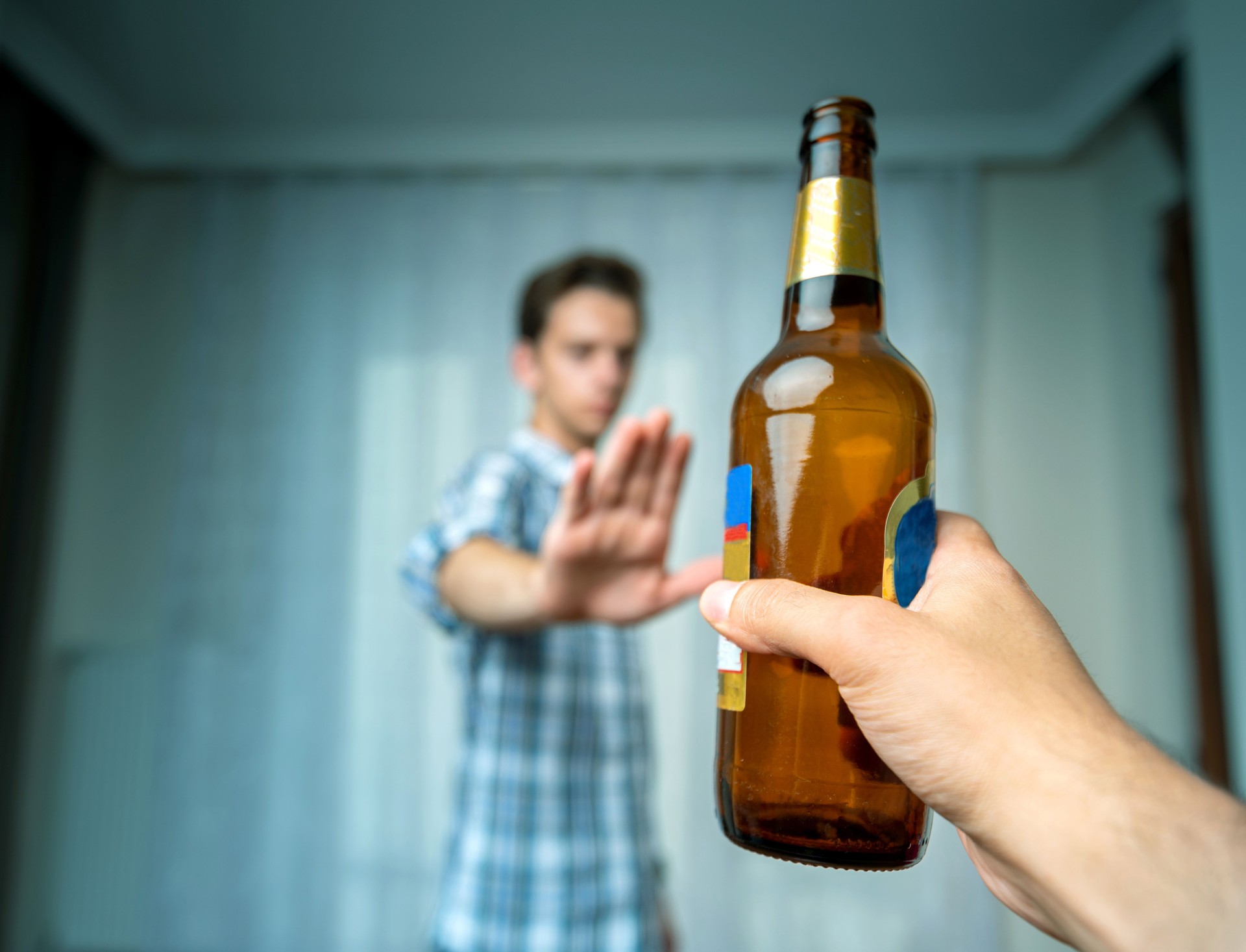 Man hand rejecting alcoholic beer beverage